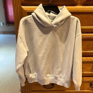Light blue crop hoodie sweatshirt. No pockets.
